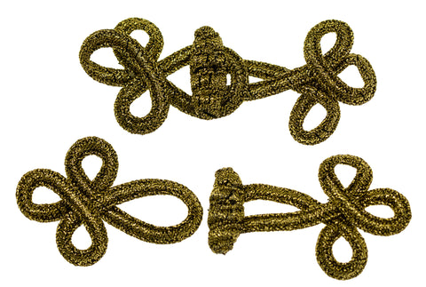 Posamenten-Verschluss altgoldfarben, zwei Kleeblatt-Knoten durch geflochtenen Steg verbunden, zweifach